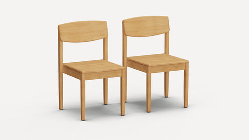 Two simple, light wood dining chairs with curved backrests and square seats on a white background.