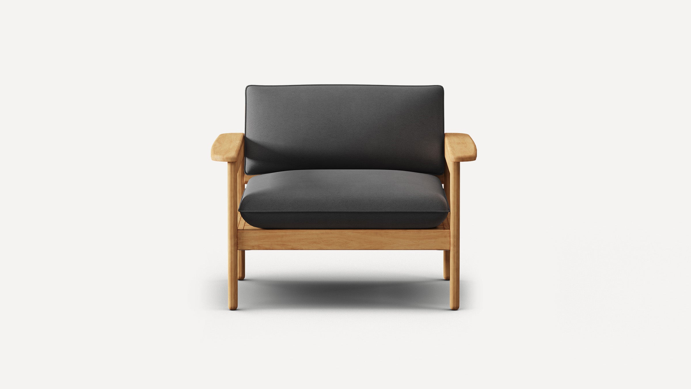 Front view of a modern armchair with wooden frame and dark gray cushioned seat and backrest on a plain white background.