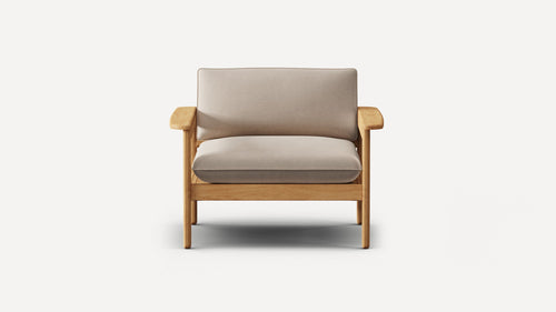 Front view of a modern armchair with light beige cushions and natural wood frame and armrests on a white background.