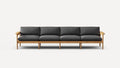 Four-seat wooden frame sofa with dark gray cushions and armrests, showcasing a minimalist modern design.
