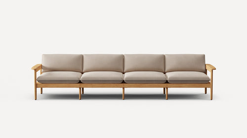 Modern four-seater sofa with light beige cushions and natural wood frame, featuring armrests and multiple legs for support.