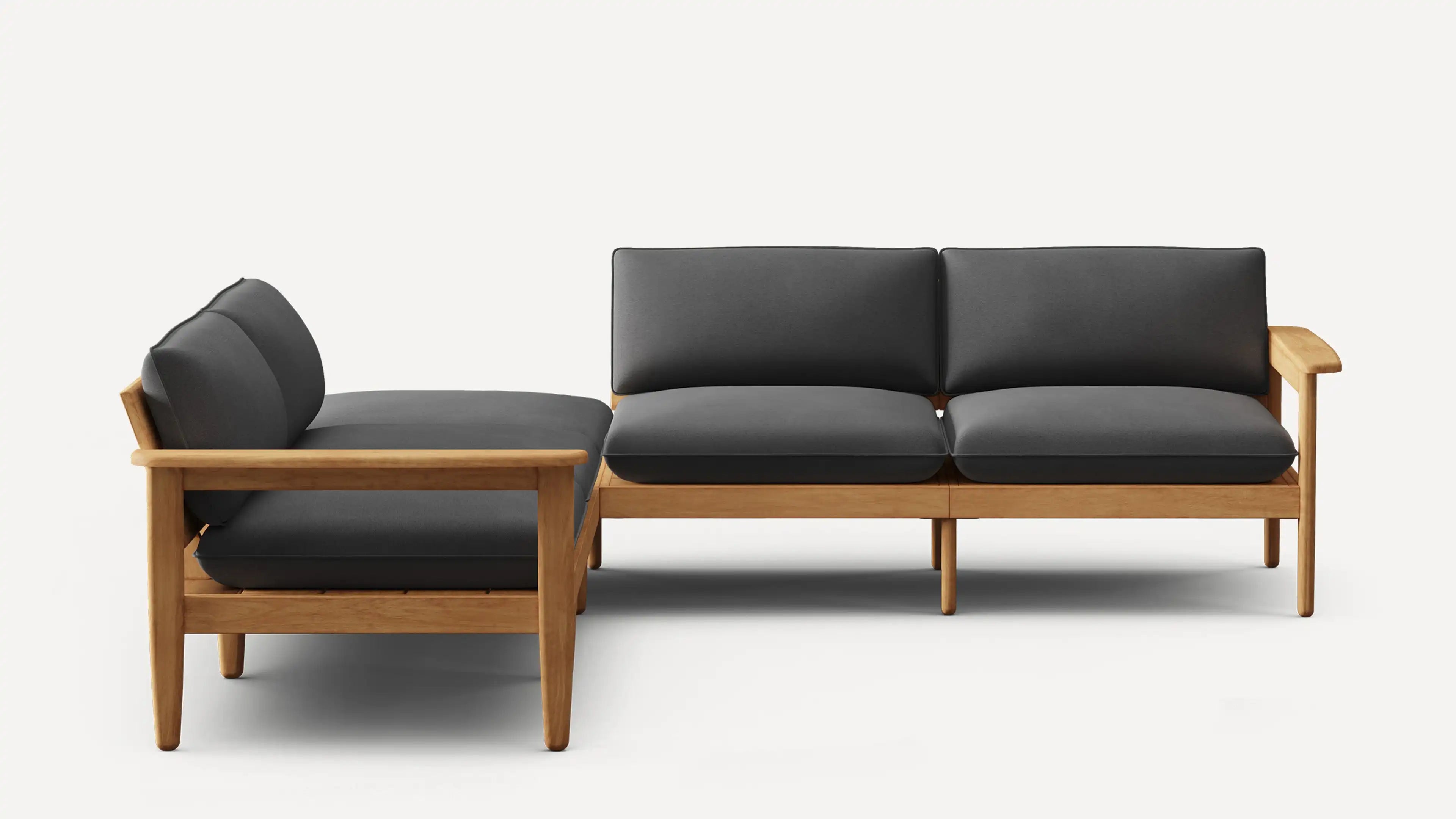 L-shaped wooden frame sofa with dark gray cushions, featuring clean lines and minimalist modern design.