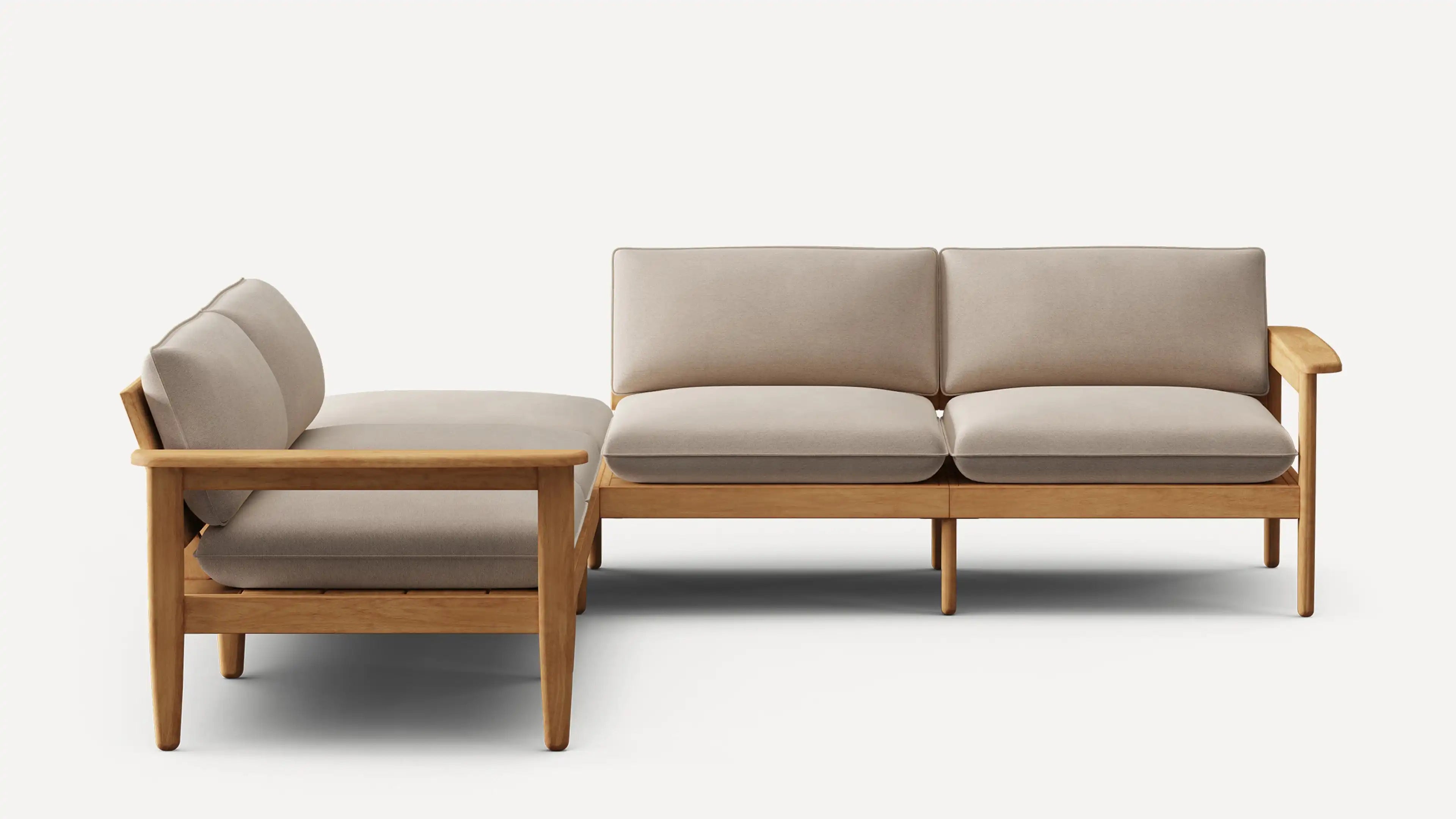 Modern L-shaped sectional sofa with light beige cushions and natural wood frame, featuring clean lines and a minimalist design.