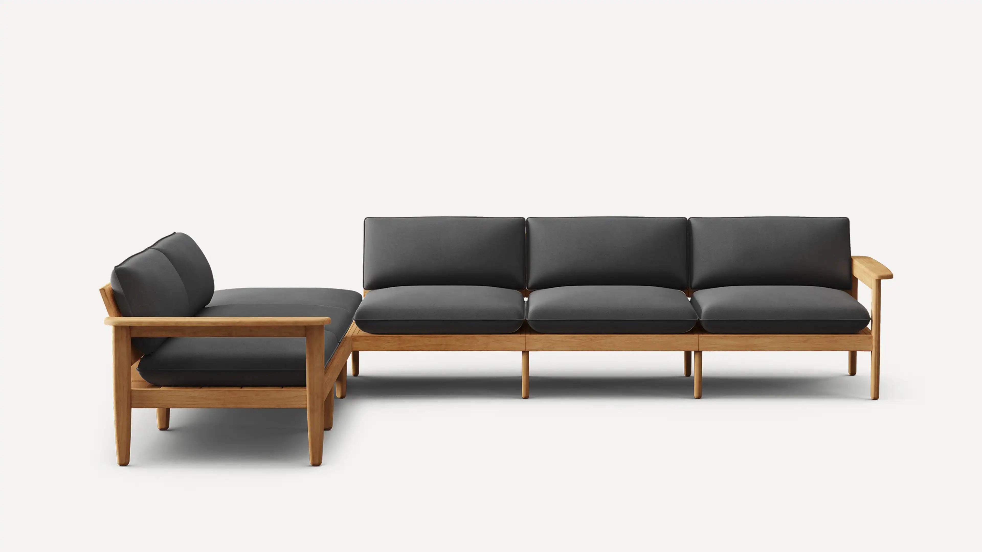 L-shaped sectional sofa with wooden frame and dark gray cushions, featuring clean lines and modern minimalist design.