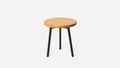 round wooden stool with black legs and a wooden seat