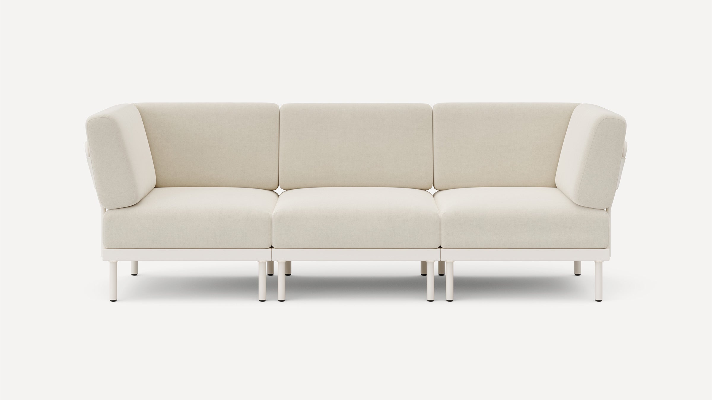 modern beige fabric sofa with metal legs and clean lines on the back, featuring a clean, minimalist design