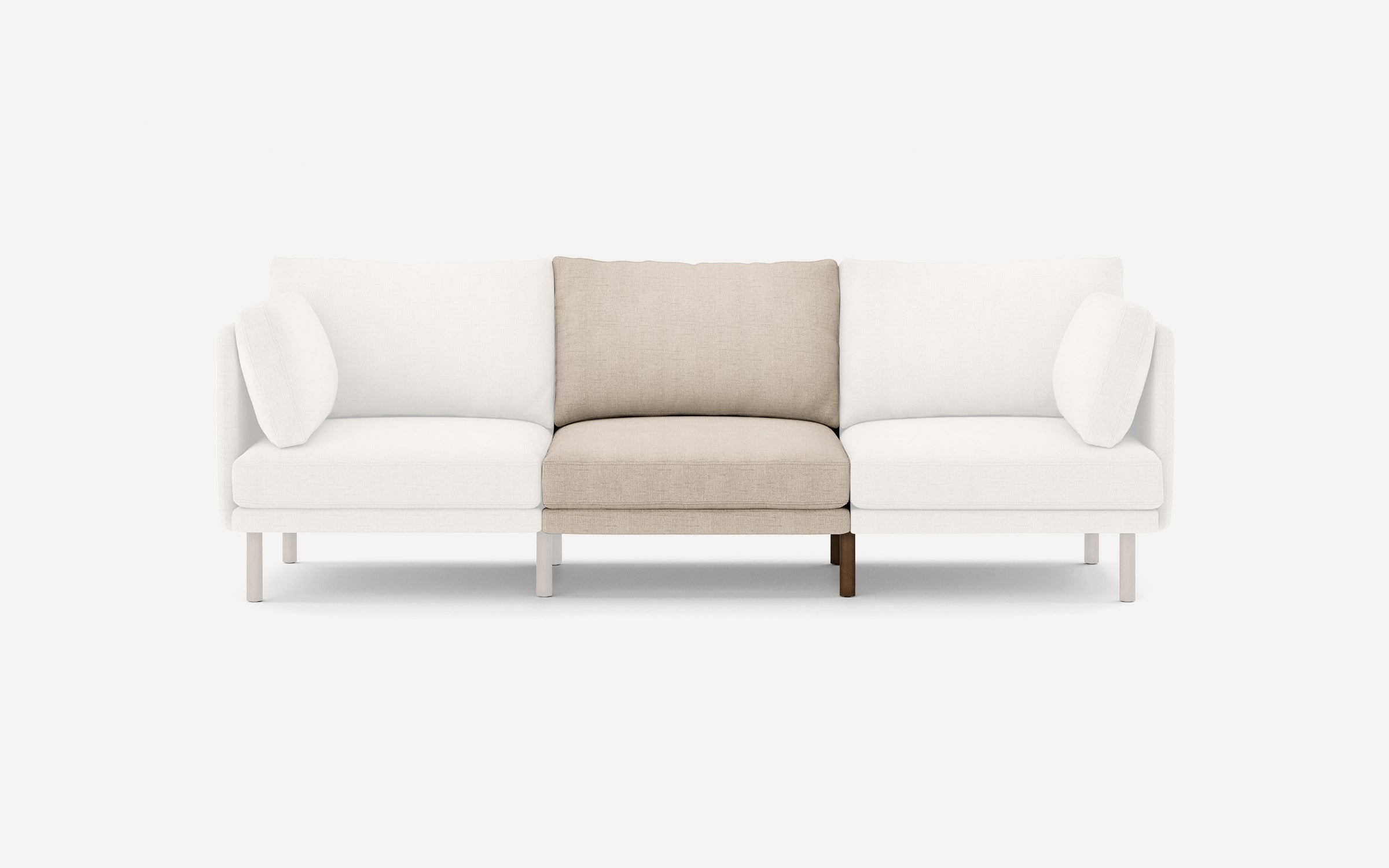 Modern three-seater sofa with white cushions on left and right, and a beige cushion in the center, featuring slim legs.