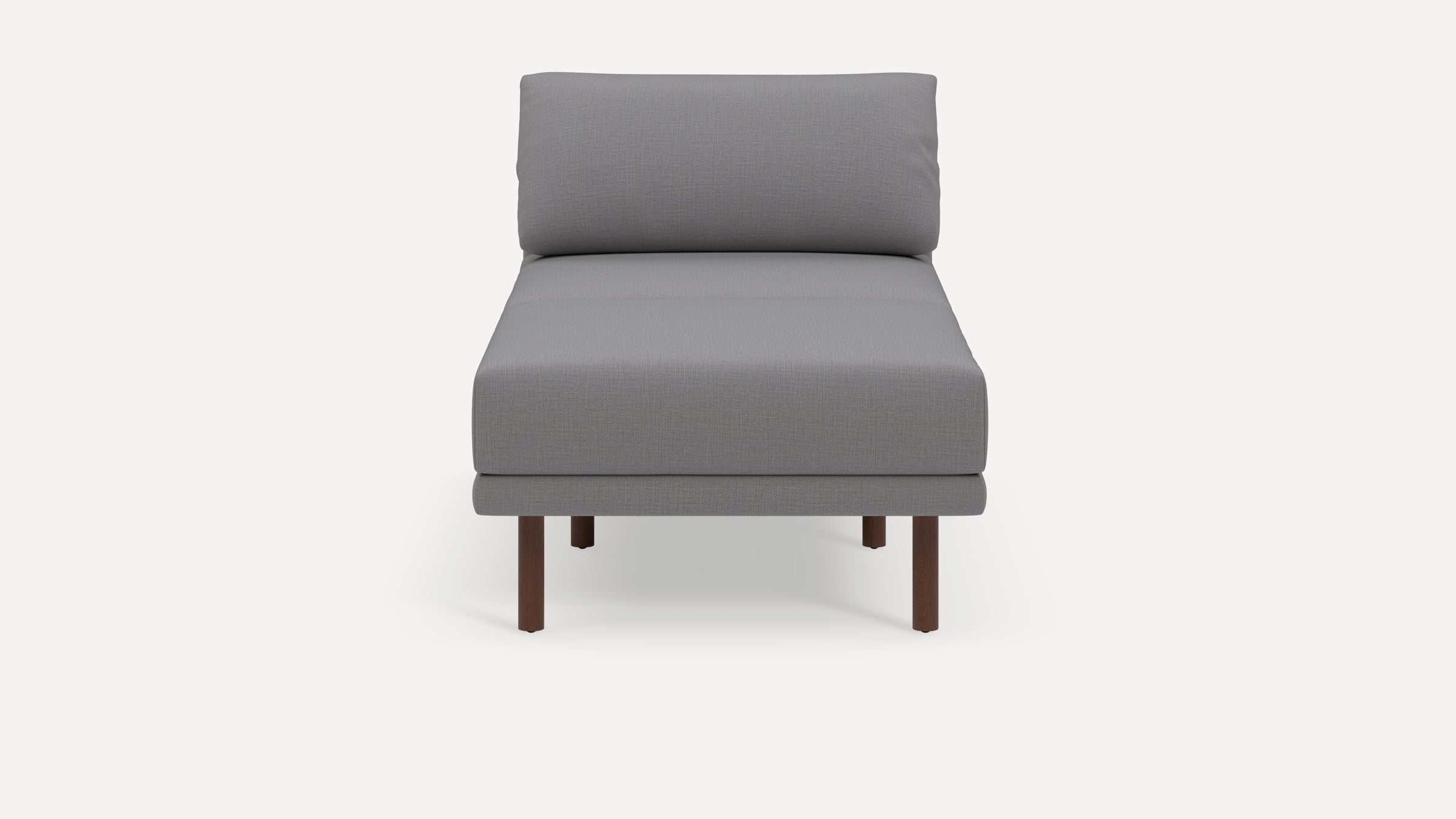Front view of a modern, minimalistic gray upholstered armless lounge chair with dark wood legs on a white background.