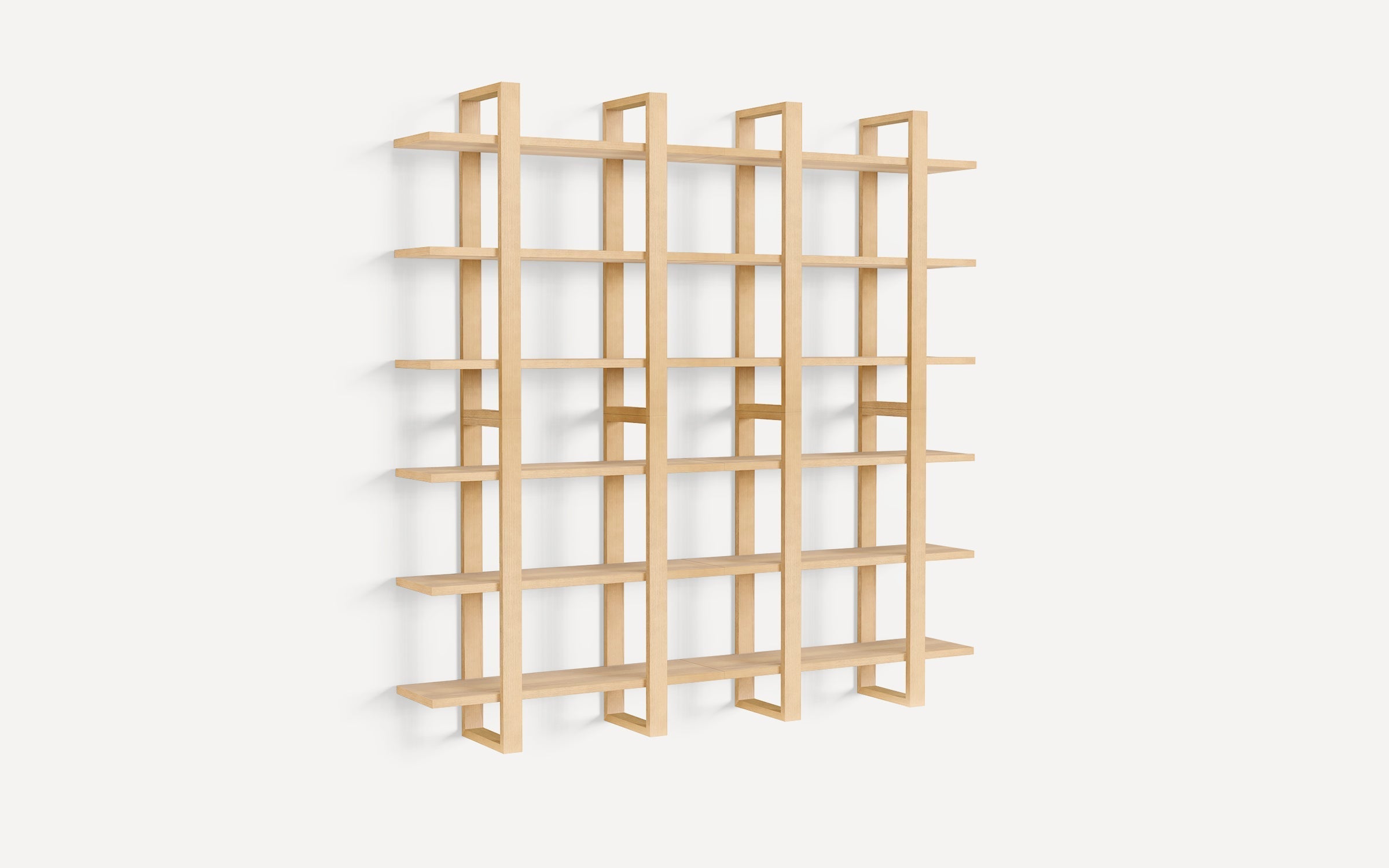 Light wood wall-mounted shelving unit with four vertical and five horizontal shelves, featuring a modern open grid design.