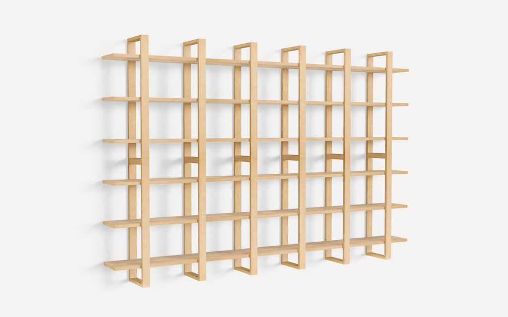 Large minimalist wooden wall-mounted shelving unit with multiple horizontal shelves and vertical supports, designed for modern interior storage and display.