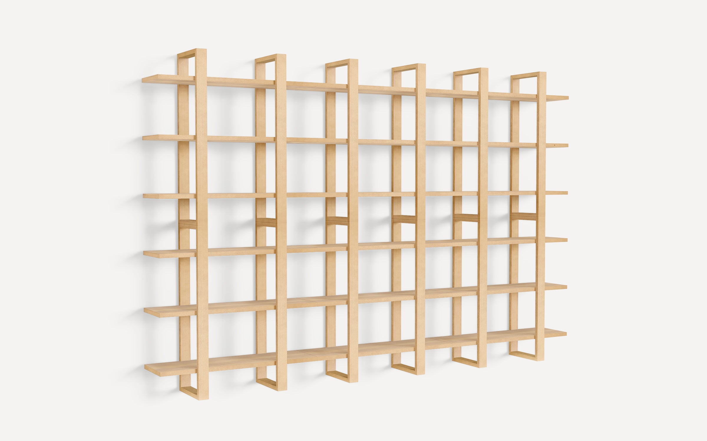 Large minimalist wooden wall-mounted shelving unit with multiple horizontal shelves and vertical supports, designed for modern interior storage and display.