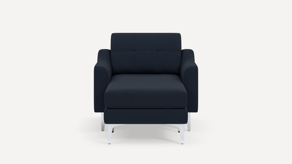 Front view of a modern navy blue armchair with metal legs and cushioned seat and backrest.