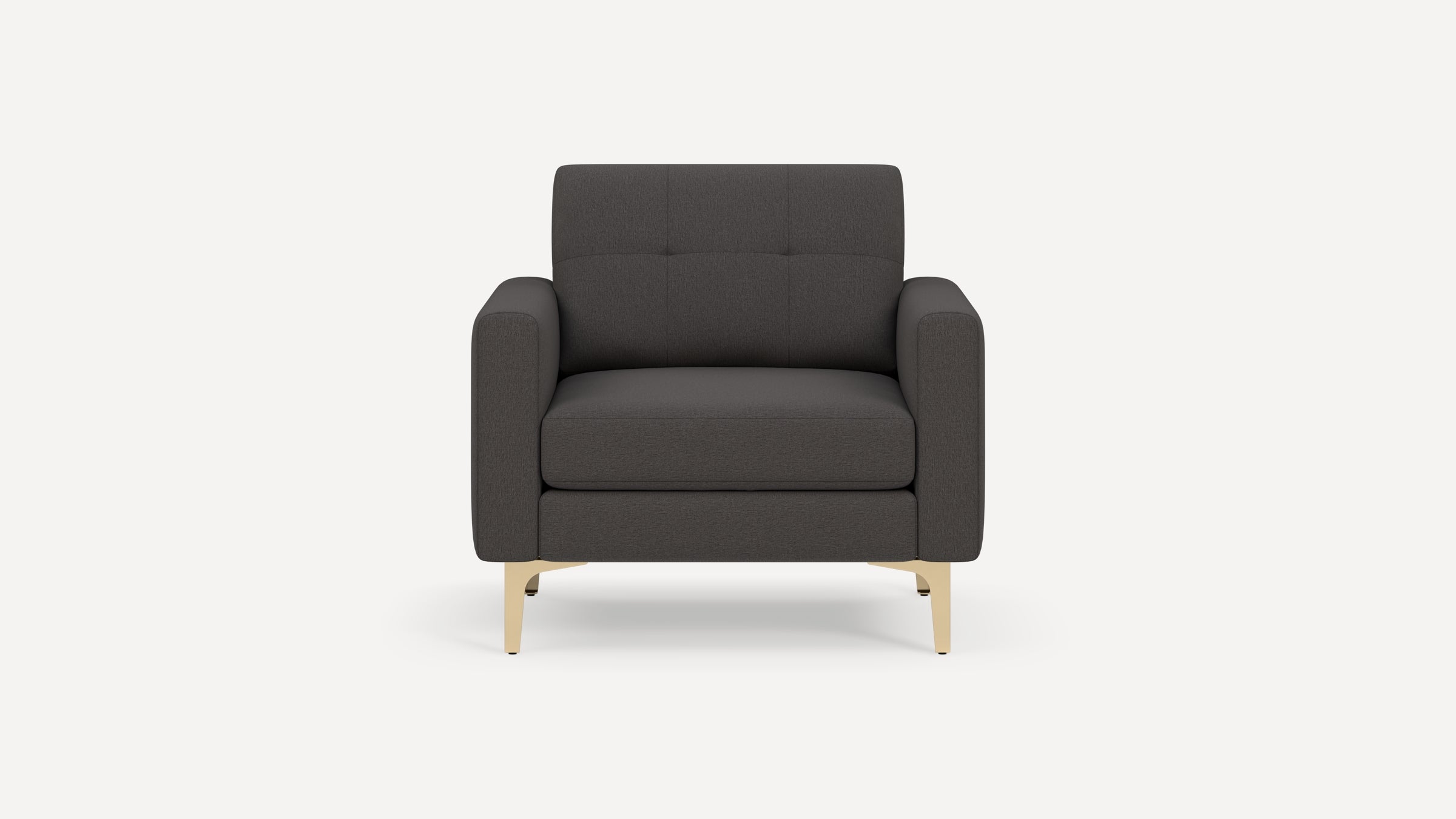 Front view of a modern dark gray armchair with padded cushions and light beige angled legs on a white background.