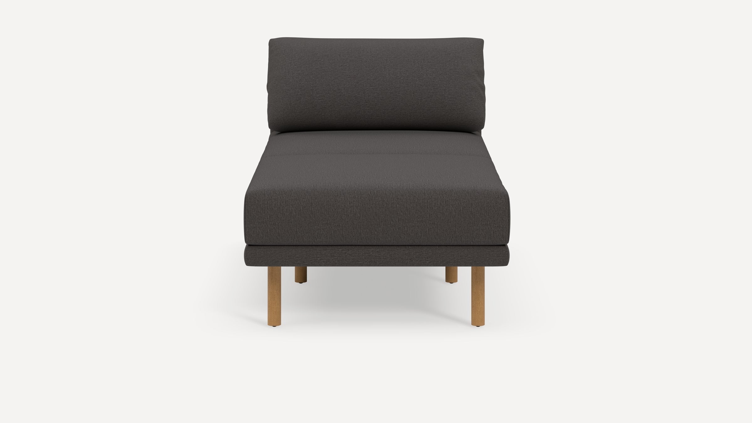 Front view of a modern dark gray upholstered armless lounge chair with light wooden legs on a white background.