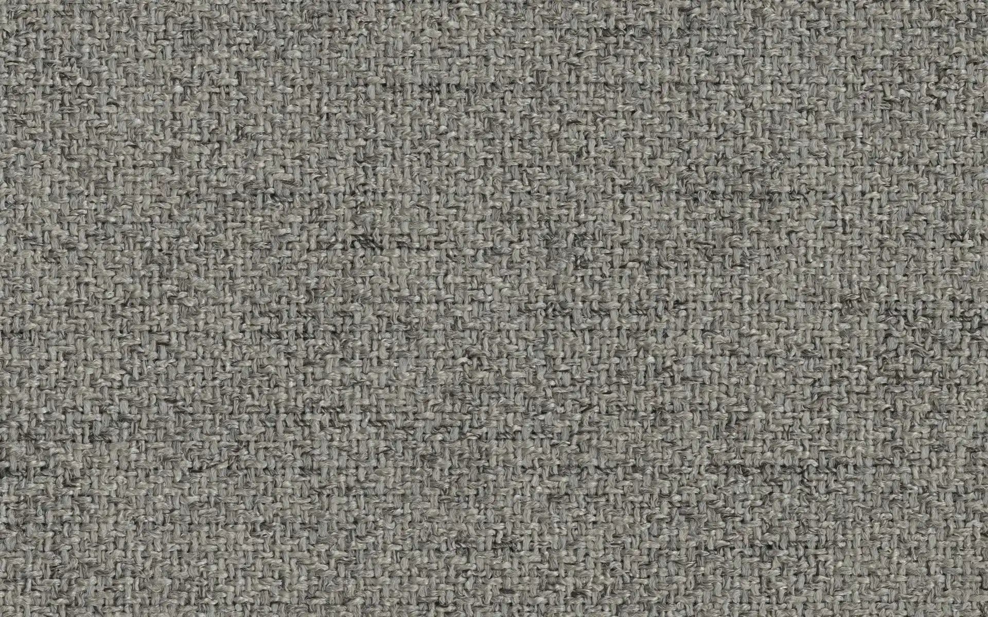 Close-up of textured gray woven fabric with a rough, interlaced thread pattern.