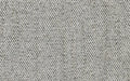 Close-up of soft, textured fabric with a woven pattern in light gray and off-white tones.