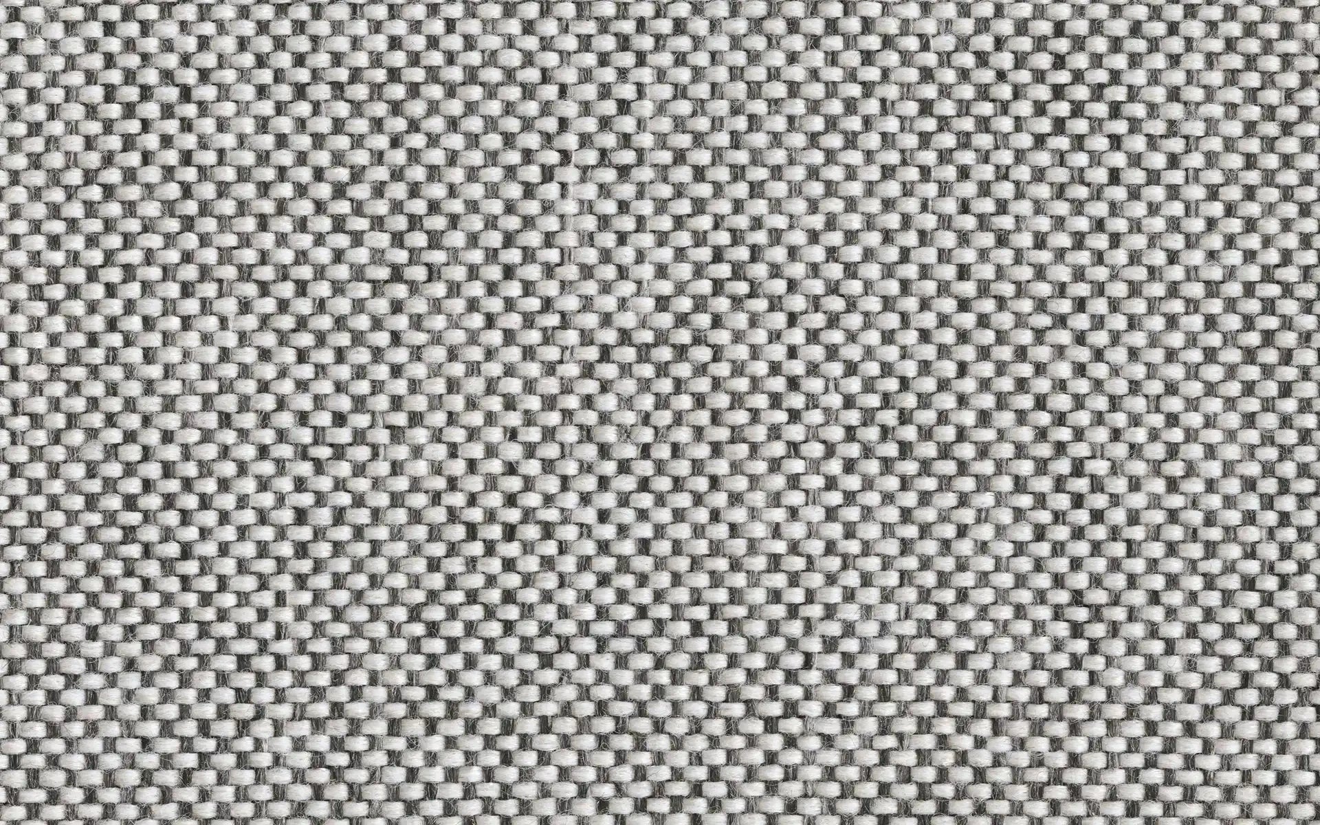 Close-up of gray and white woven fabric texture with small rectangular patterns.