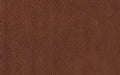 Close-up of rich brown textured leather surface with natural grain patterns and fine creases.