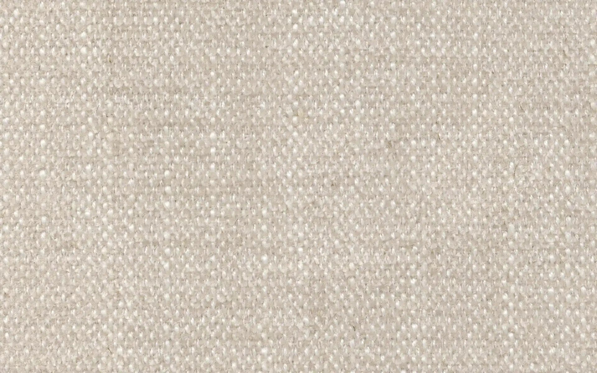 Close-up of beige woven fabric with a soft texture and tightly knit threads, suitable for upholstery or clothing.