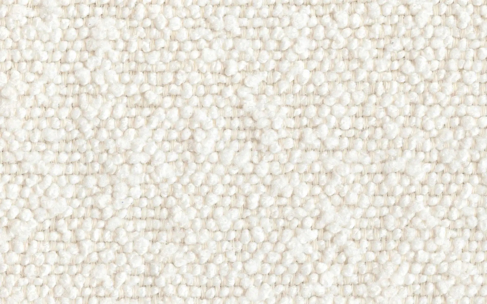 Close-up of textured white looped fabric with a woven pattern, soft and thick material.