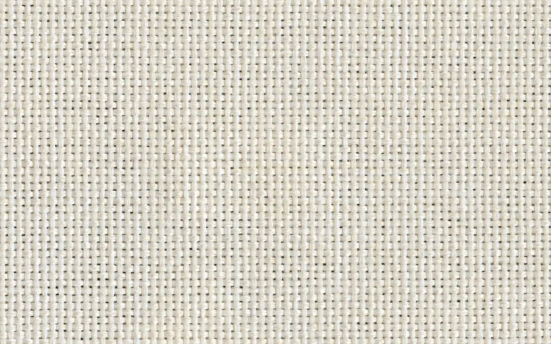 Close-up of tightly woven beige fabric with a basketweave texture, showing detailed interlacing threads.