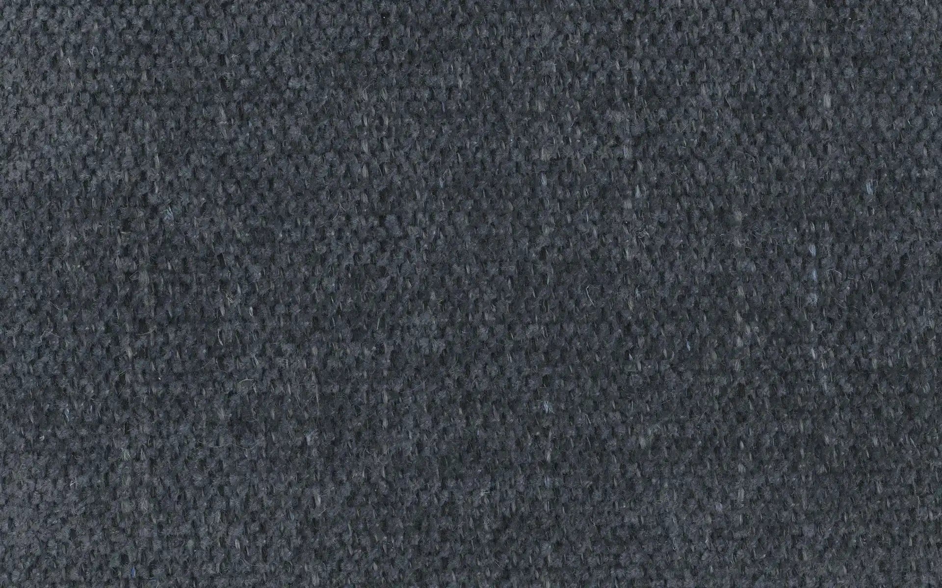 Close-up of dark gray woven fabric with tightly knit textured pattern and visible fibers.