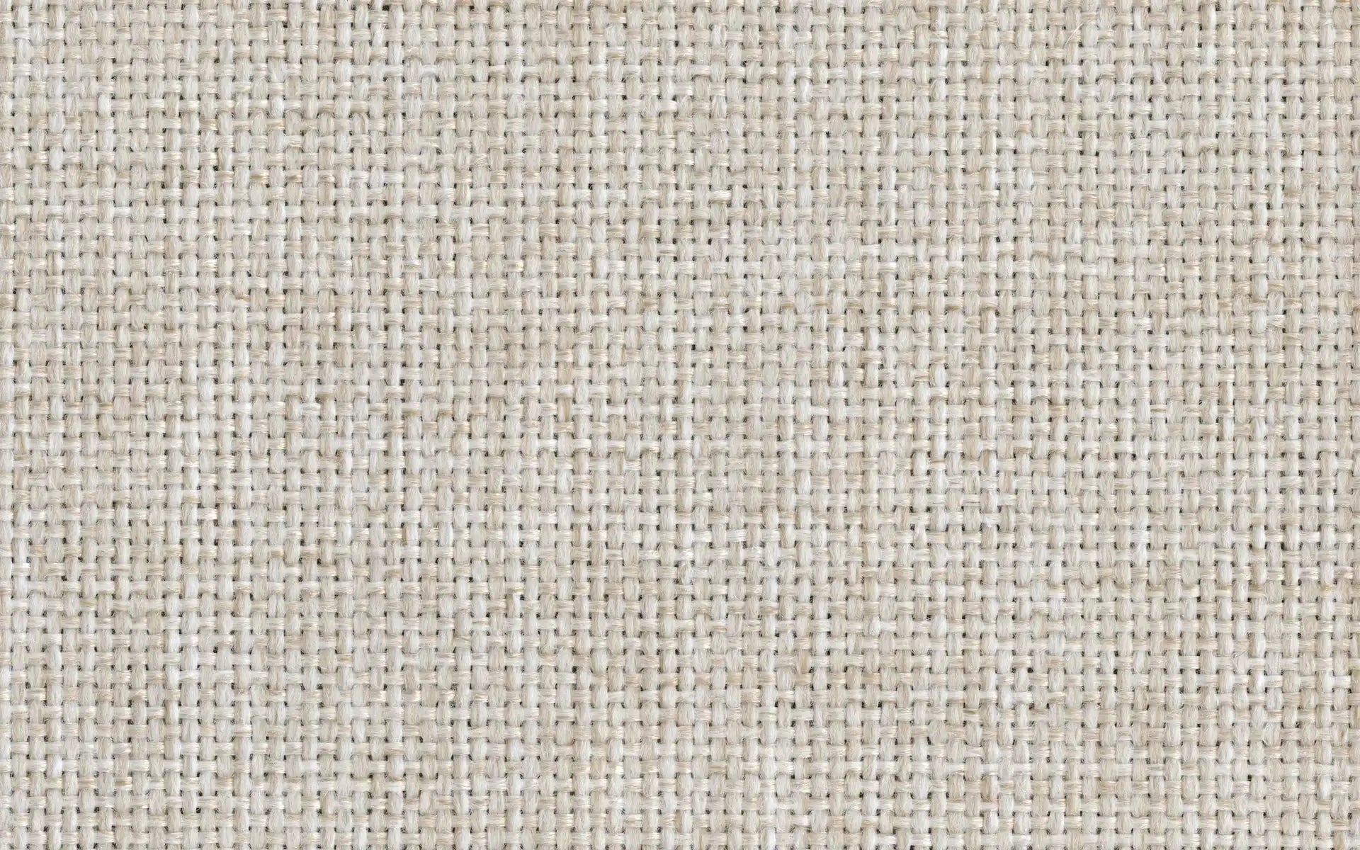 Close-up image of beige woven fabric with a textured, basket-weave pattern.