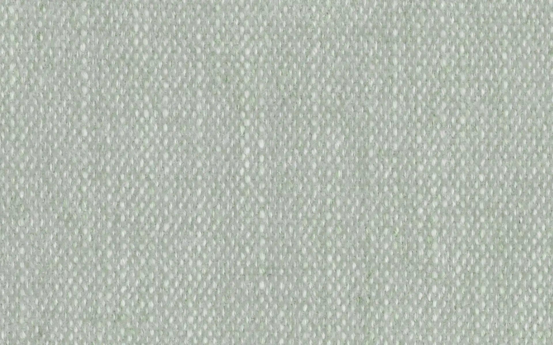 Close-up of light gray woven textured fabric with a subtle diagonal pattern and soft appearance.