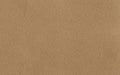 Close-up of a textured brown corkboard surface, showing natural grain and pattern.