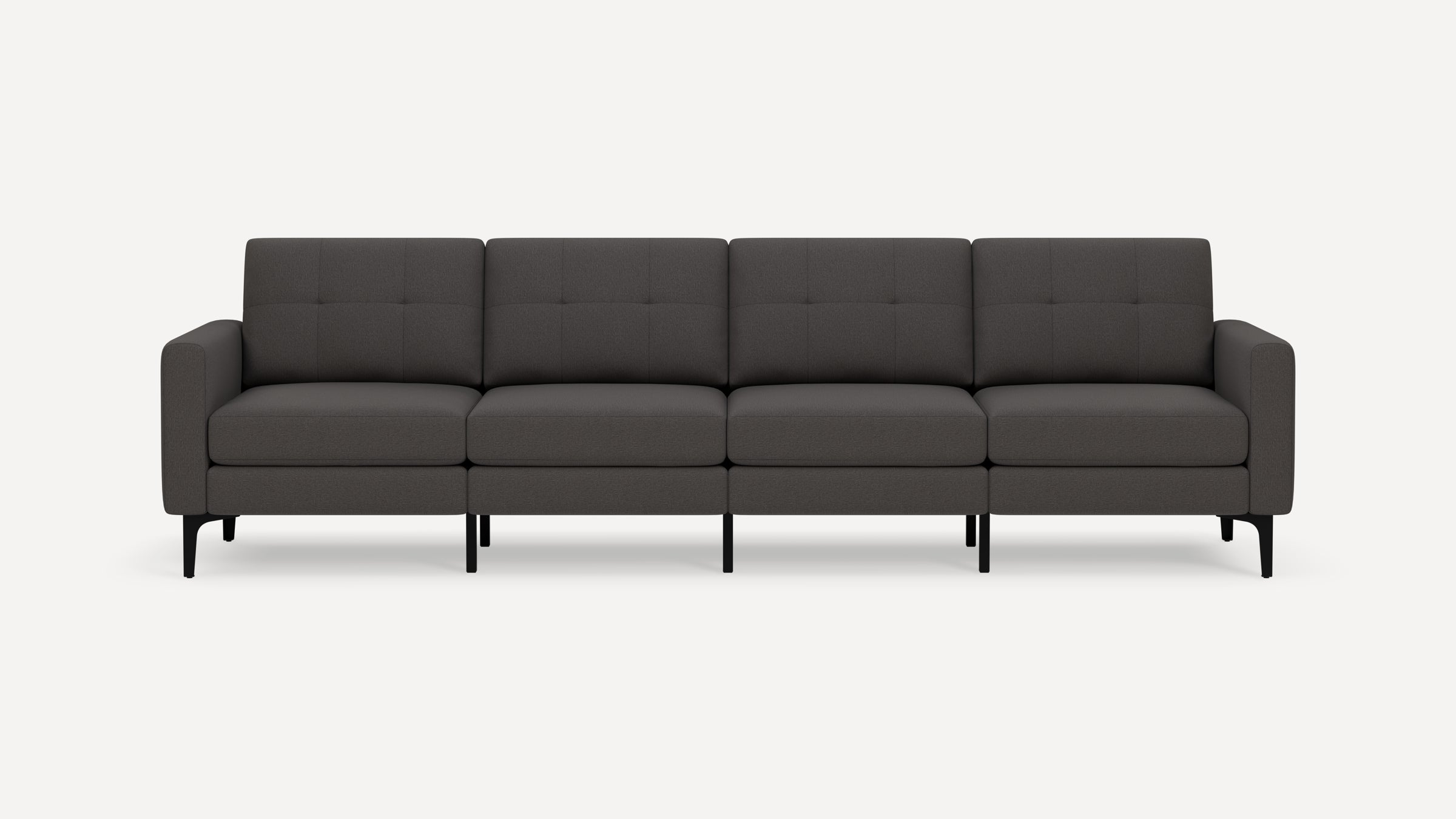 Four-seater modern dark gray fabric sofa with tufted back cushions, straight armrests, and slender black metal legs.