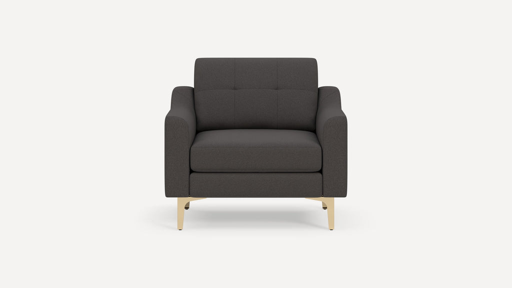 Front view of a modern dark gray upholstered armchair with tufted backrest and light wooden legs.