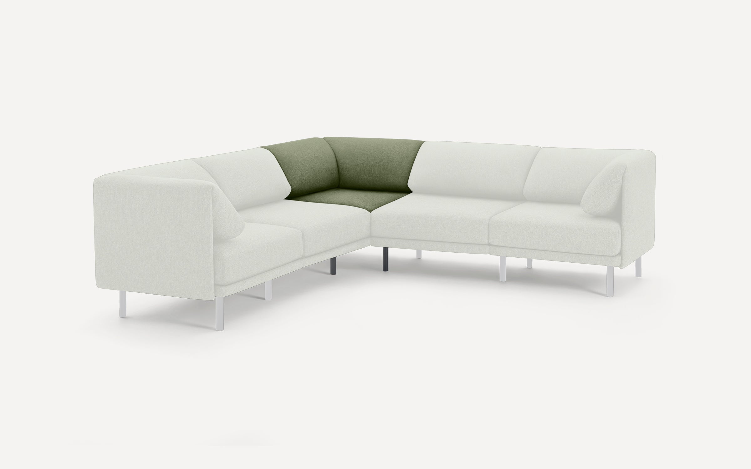 Sectional sofa with white upholstery and contrasting olive green corner cushion, supported by slim white legs.