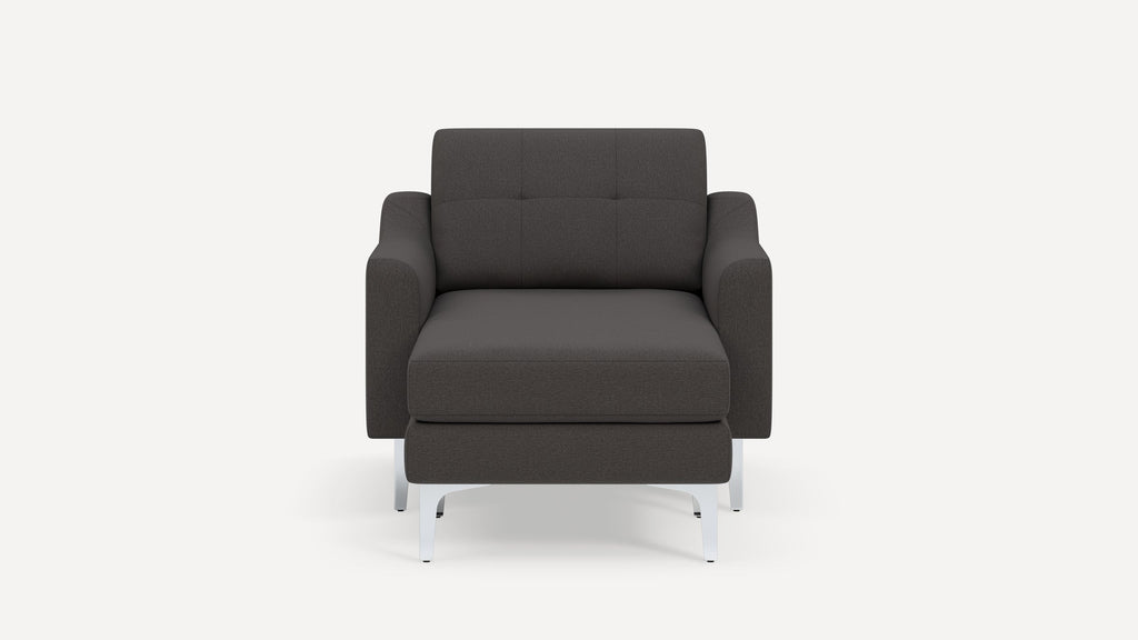 Modern dark gray fabric armchair with tufted backrest and metal legs, shown from the front on a plain background.
