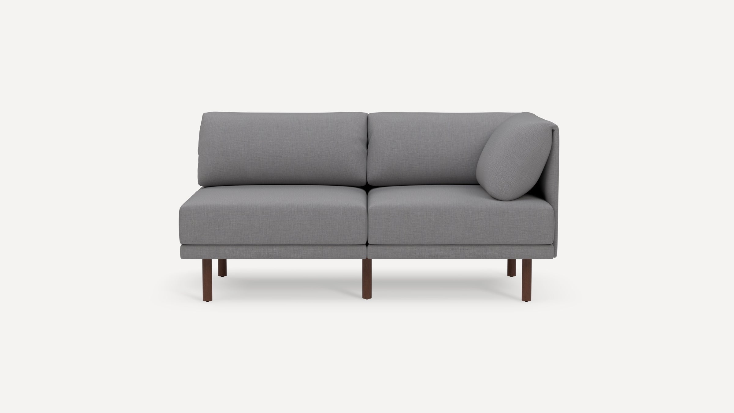 Modern light gray two-seater sofa with wooden legs and a cylindrical cushion on one side, set against a plain background.
