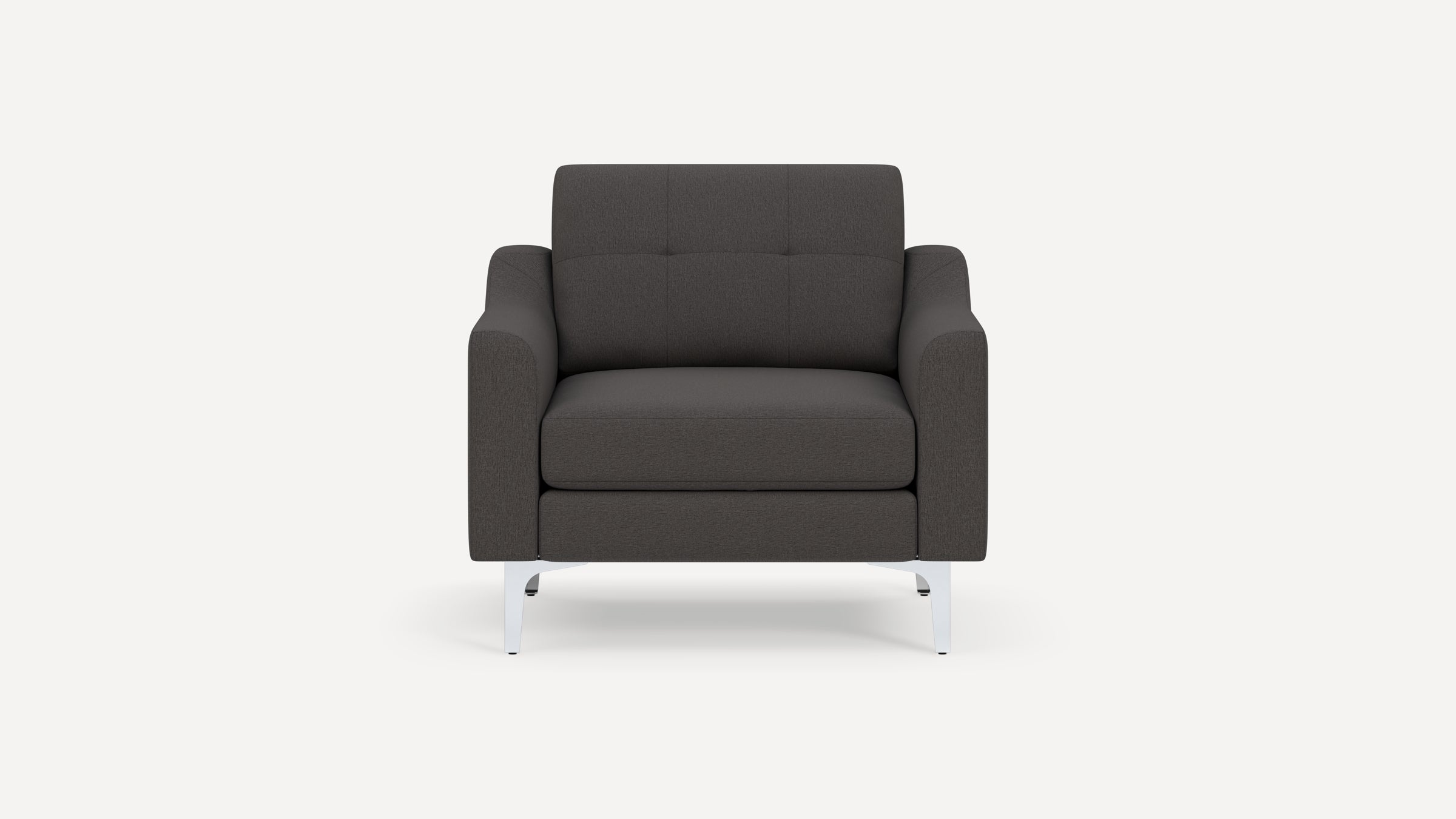 Dark gray upholstered armchair with tufted backrest, wide armrests, and sleek silver metal legs, shown against a white background.