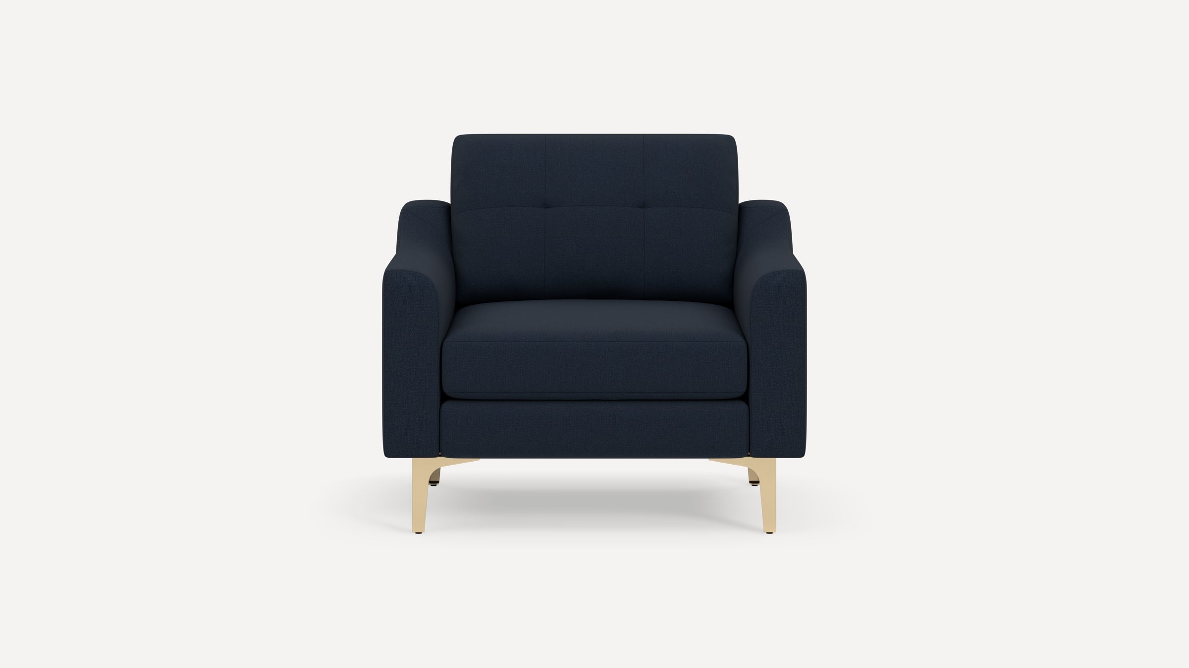 Modern navy blue armchair with cushioned seat and backrest, supported by light wooden legs on a white background.
