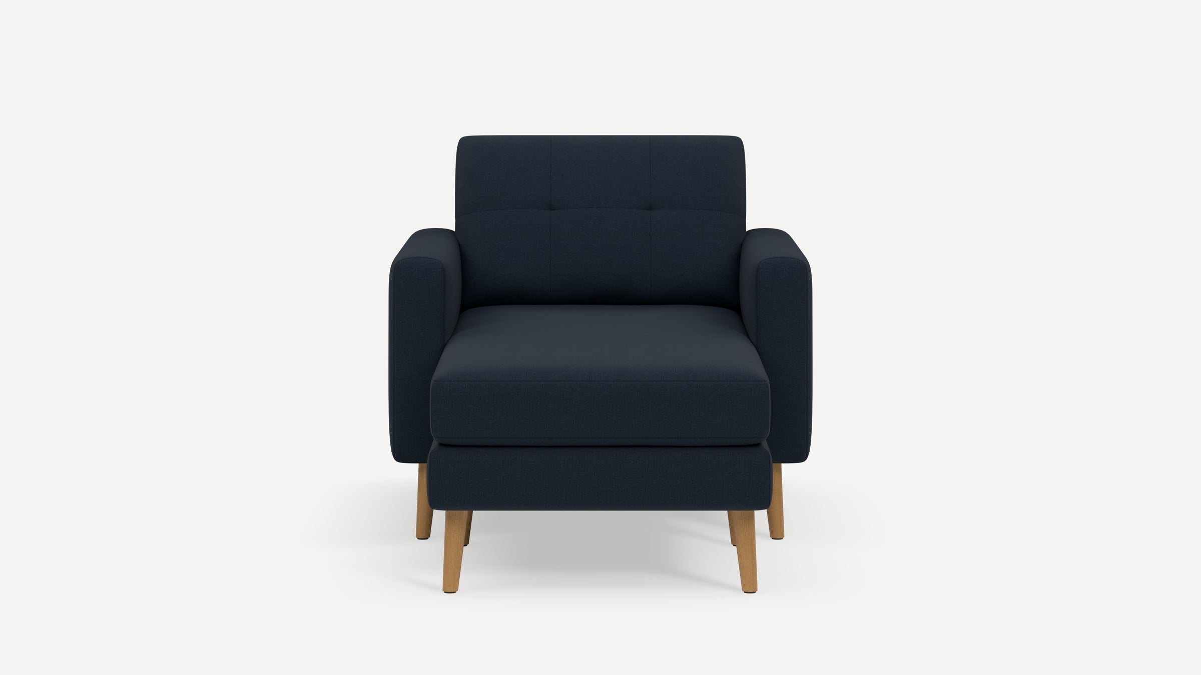 Front view of a modern navy blue armchair with wooden legs and cushioned seat and backrest.