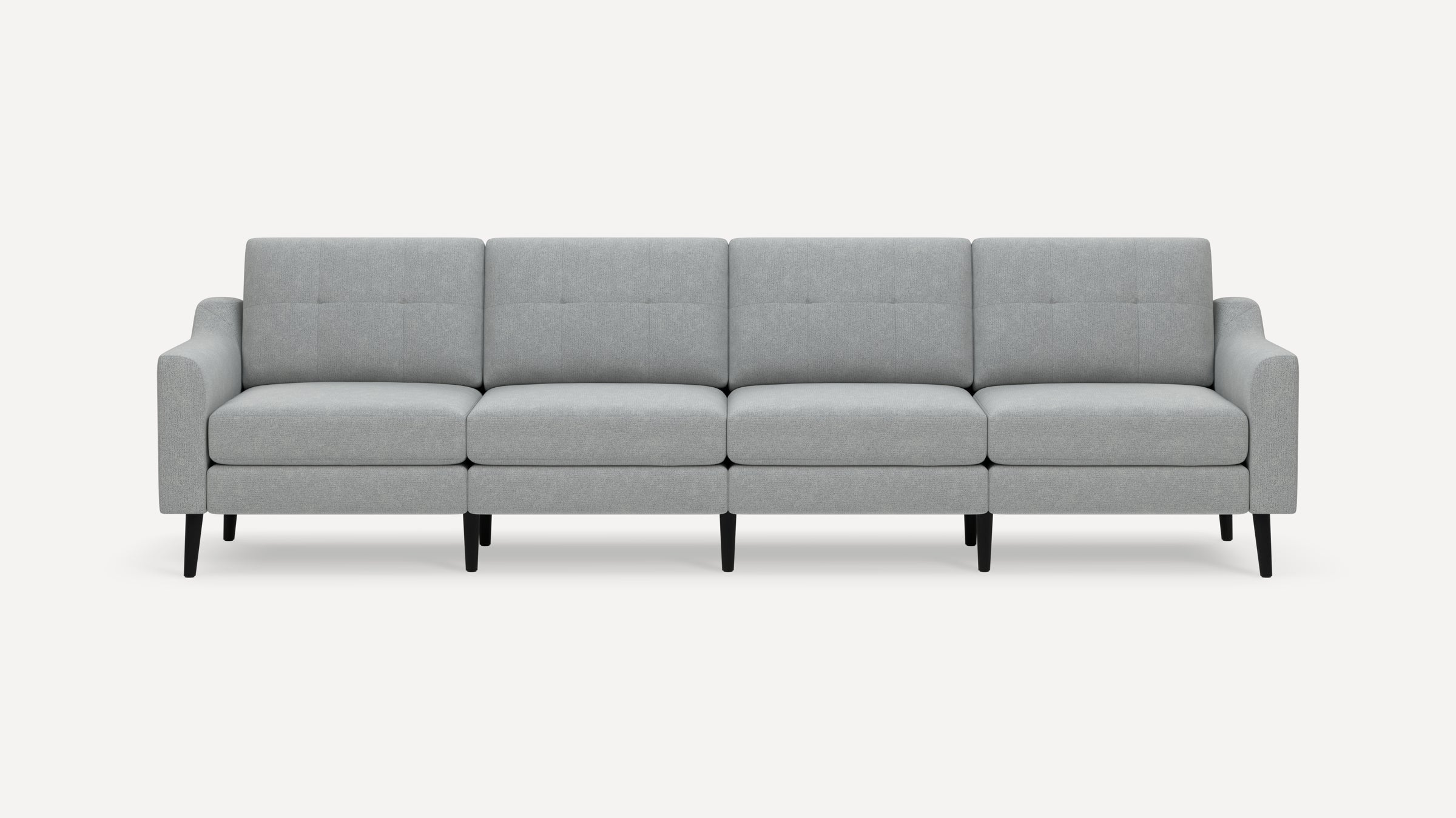 Light gray modern four-seater sofa with button-tufted back cushions and black tapered legs on a white background.