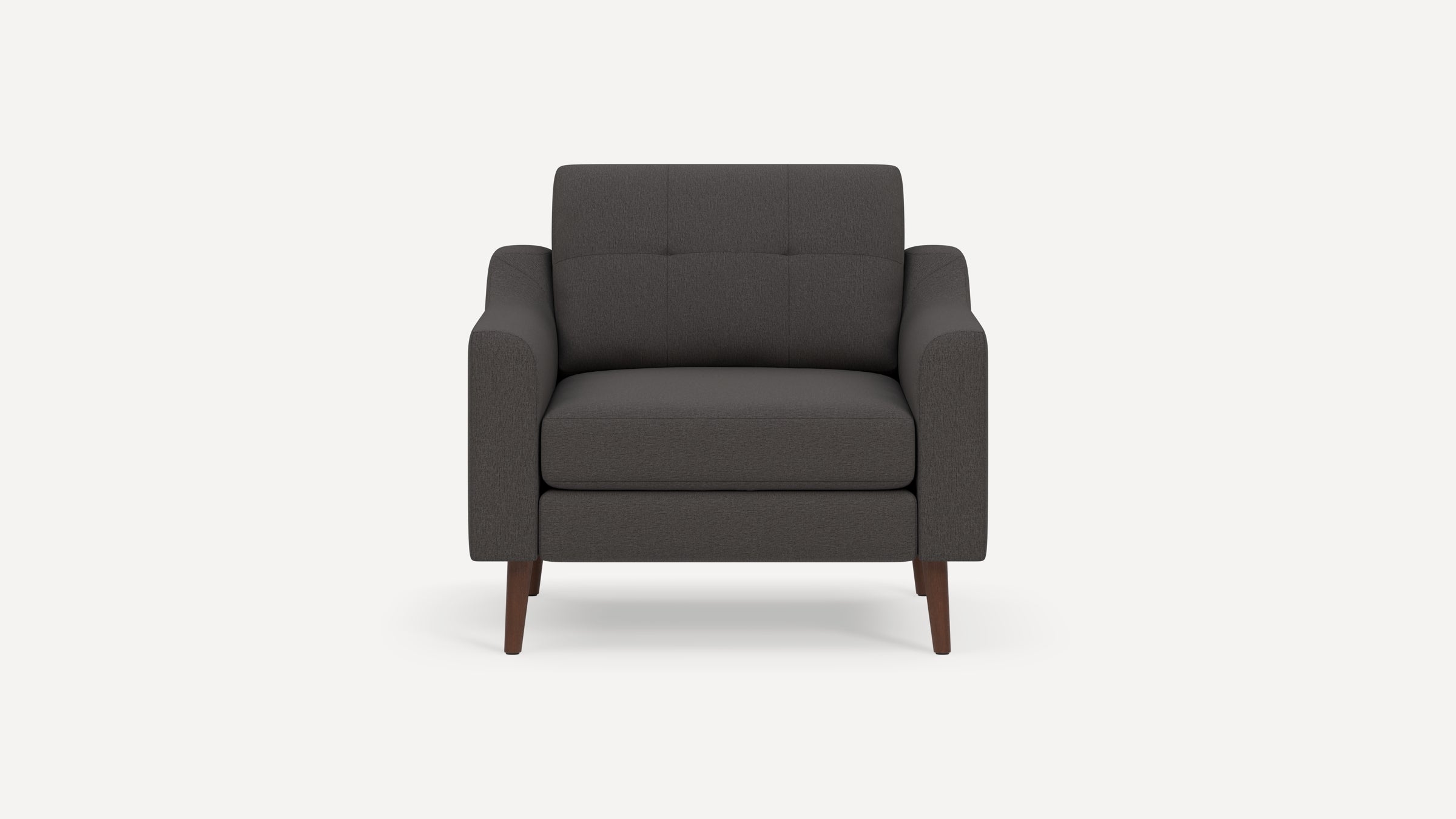 Front view of a modern dark gray upholstered armchair with tufted backrest and wooden legs on a white background.