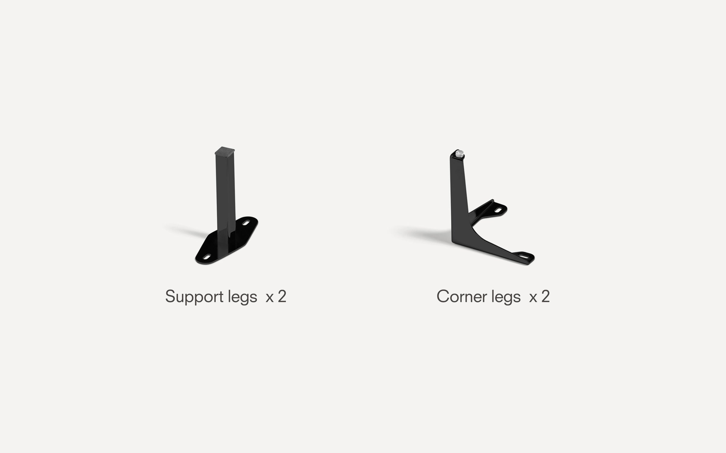 Two black metal support legs and two black metal corner legs for furniture assembly on a white background.