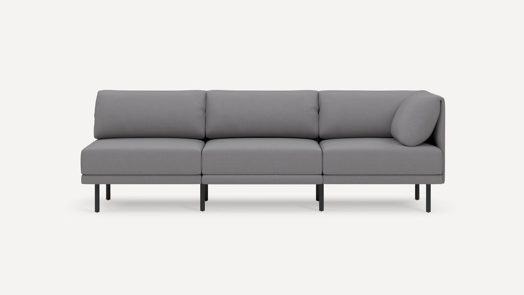 Modern gray three-seater sofa with clean lines, plush cushions, and slim black metal legs on a white background.