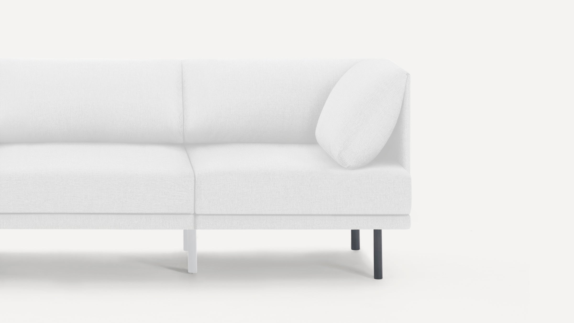 Right section of a modern white fabric sofa with clean lines, thin black legs, and a single matching cushion against a white background.