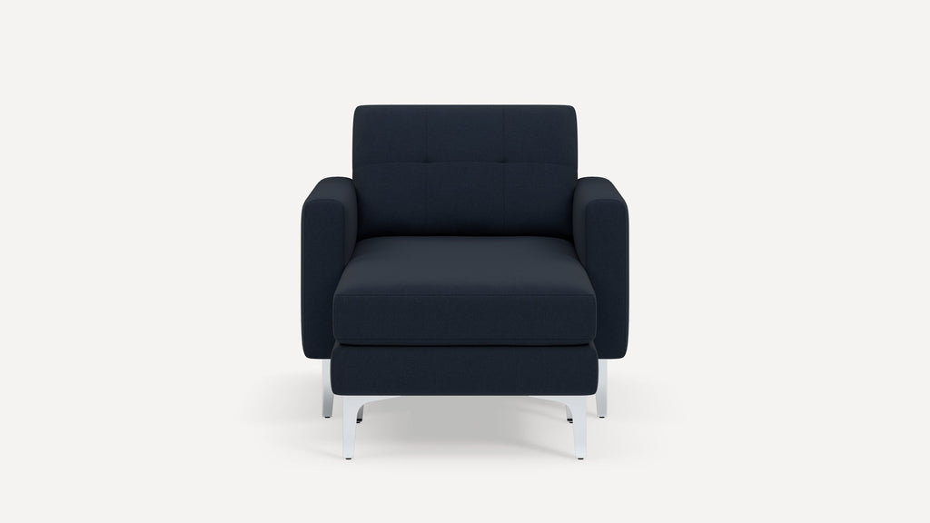 Front view of a modern navy blue armchair with metal legs and a cushioned seat and backrest.