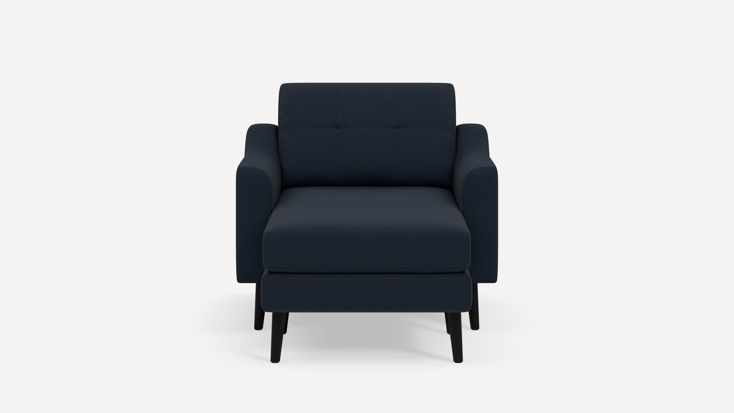 Modern navy blue armchair with matching ottoman, featuring clean lines, tufted backrest, and black wooden legs.