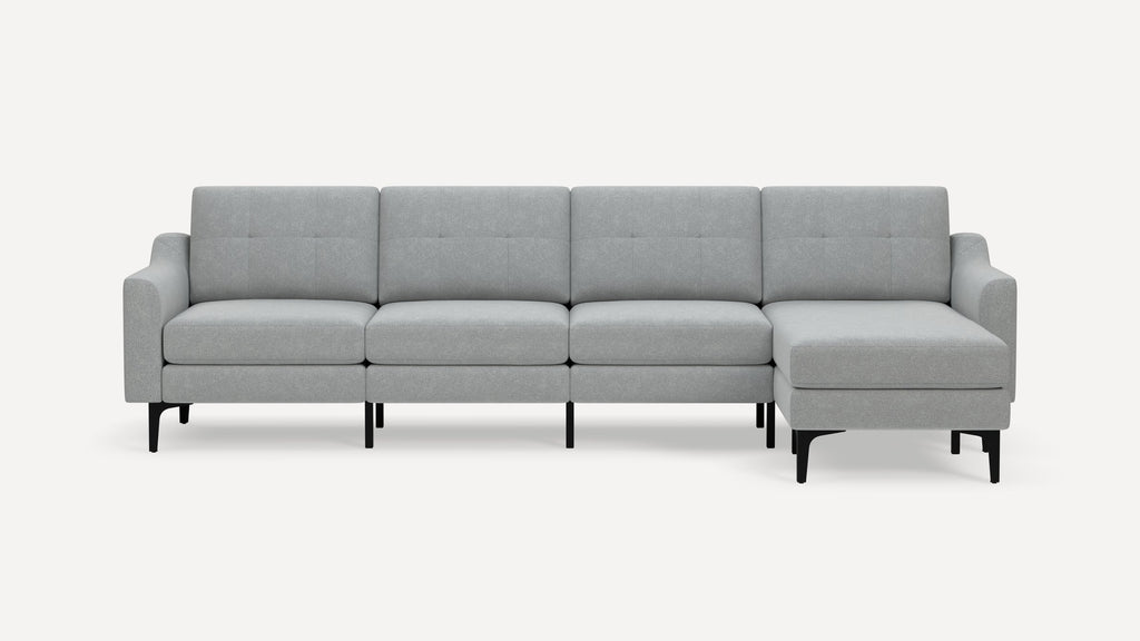Light gray modern sectional sofa with tufted cushions, straight arms, and black slender legs, featuring a right-side chaise lounge.
