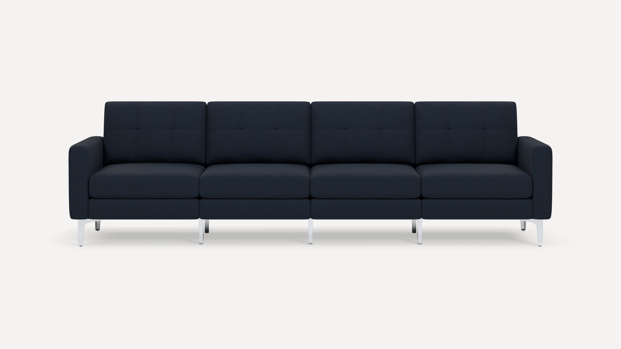 Modern navy blue four-seater sofa with clean lines, tufted cushions, and silver metal legs, set against a plain white background.