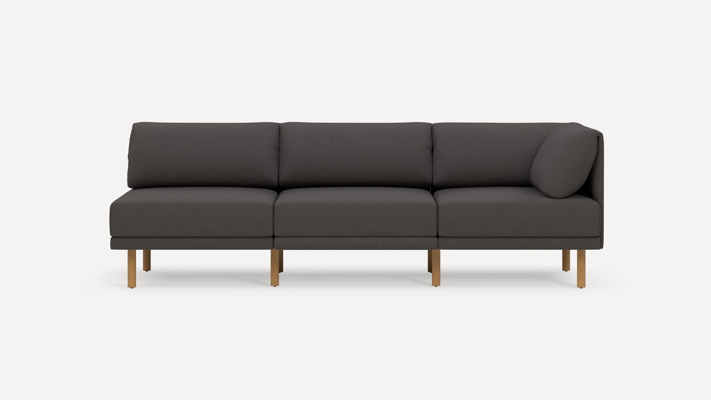 Modern dark gray three-seater sofa with wooden legs, clean lines, and plush cushions against a plain white background.