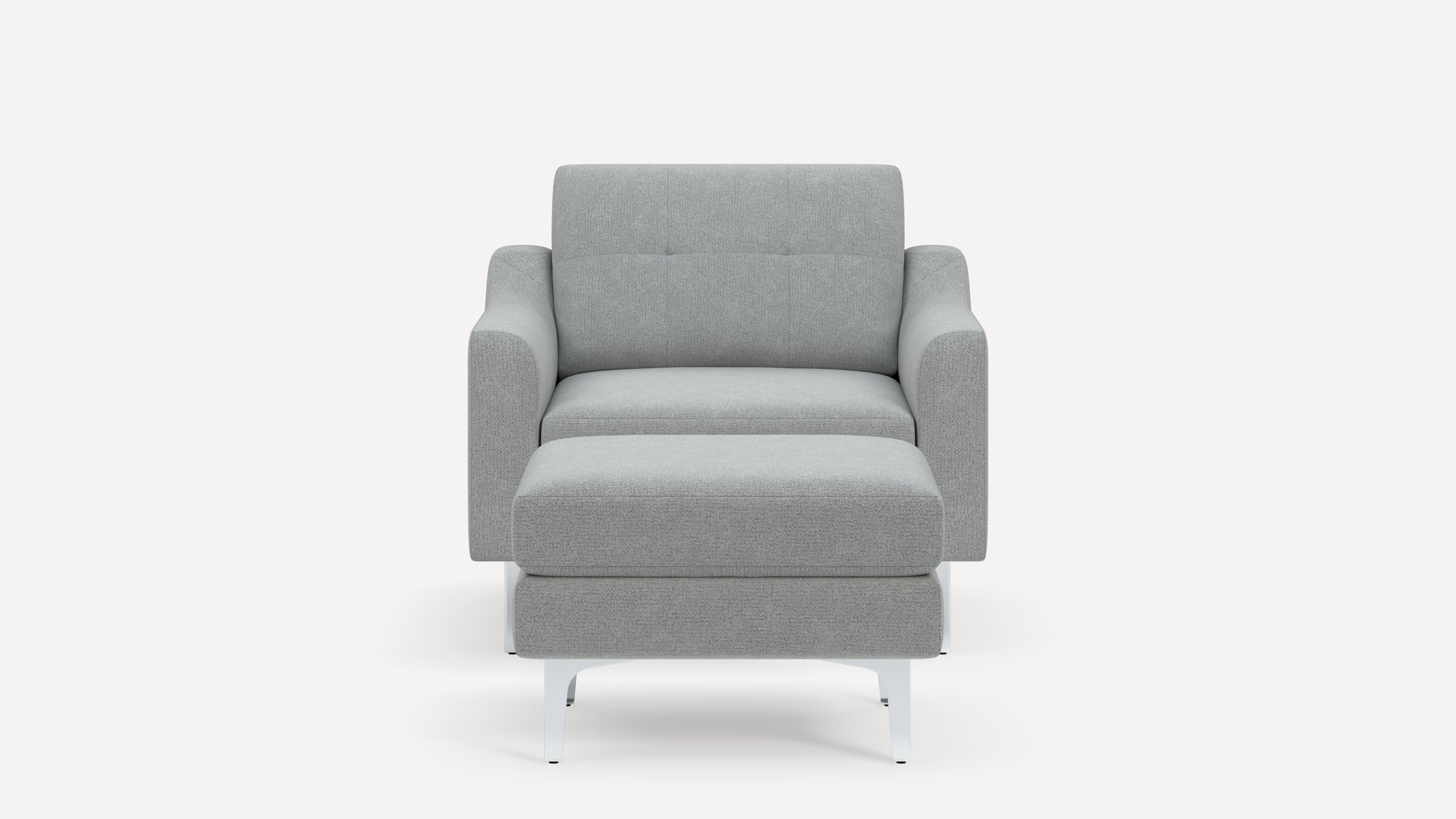 Front view of a modern light gray fabric armchair with matching ottoman and white metal legs on a white background.