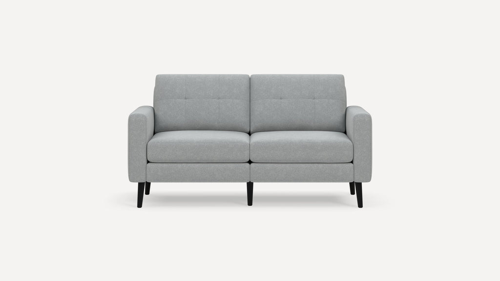 Light gray modern two-seater sofa with tufted back cushions, straight arms, and black tapered legs on a white background.
