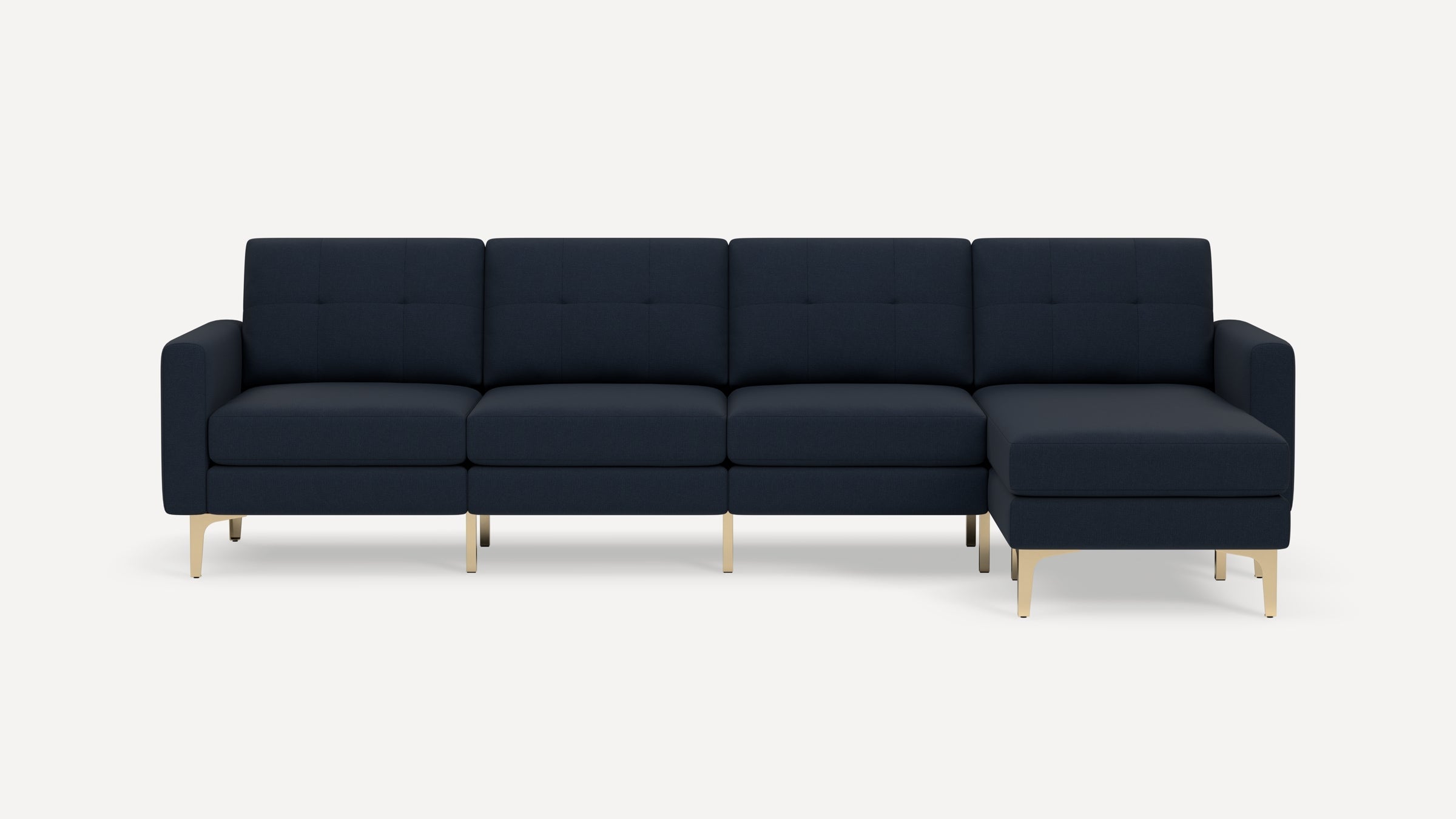 Modern navy blue sectional sofa with tufted cushions and gold metal legs, featuring a right-side chaise lounge.